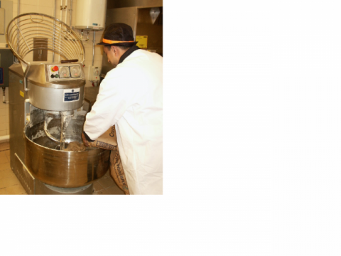 Image: supermarket baker putting flour into a mixing machine.  Paul Cullinan presents the Lane Lecture 2013 on 1 November 2013